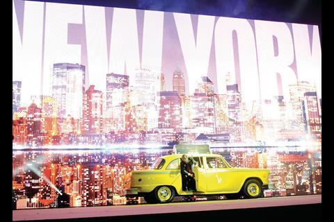 Malcolm Walker put on a show at the store managers’ conference, arriving on stage in a yellow taxi